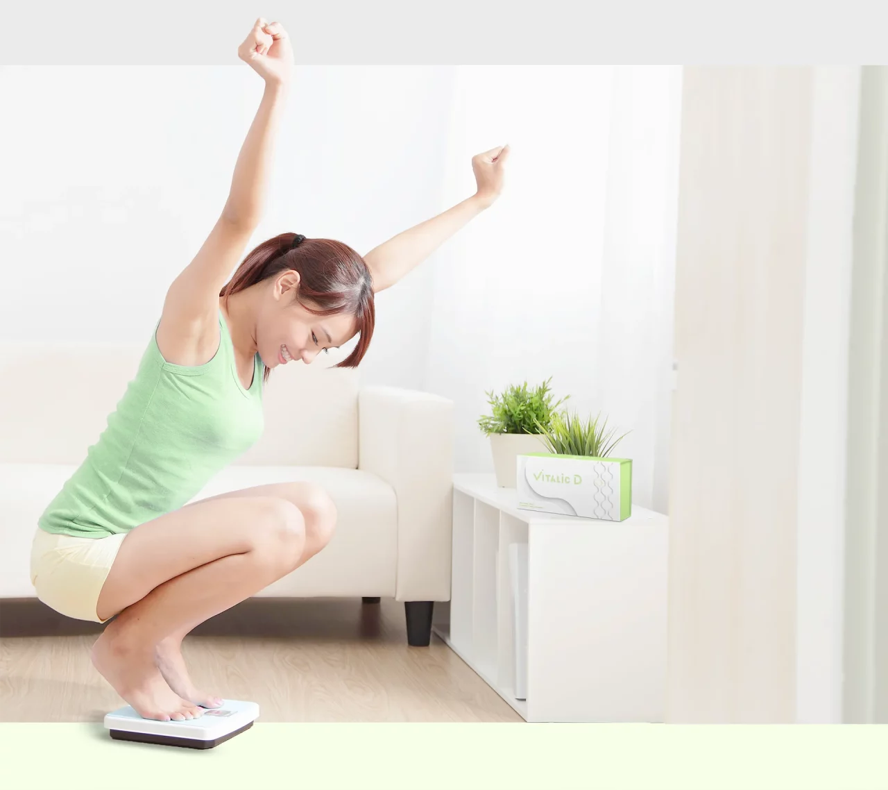 Pretty girl read the weighing result happily after complete colon cleanse for weight loss and reshape body alignment at home